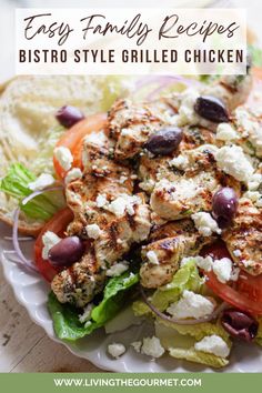 a white plate topped with chicken and salad