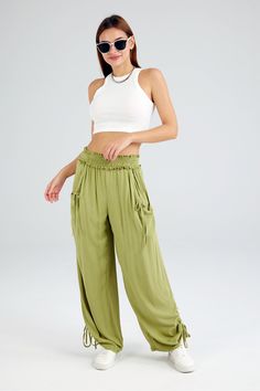 Fit: Regular fit. Detail: Two ways of wearing it. Mid-waisted. Solid color. Shirred. Knotted. Elastic waist. Wide-leg long pants. Front side two pockets. Casual loose style. Material: 100% Rayon. Care： Machine washes cold, tumble dry low. Color may be lighter or darker due to the different displays. High-waisted Yoga Bottoms With Pockets, Versatile Stretch Pants With Drawstring, Solid Color Drawstring Yoga Pants, Solid Color Yoga Pants With Drawstring, Yoga Pants With Drawstring, Casual Yoga Bottoms With Pockets, Stretch Harem Pants With Drawstring, High-waisted Wide Leg Yoga Pants With Pockets, Stretch High Waist Wide Leg Pants With Drawstring