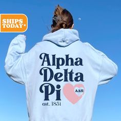 the back of a woman's white hoodie that says, alpha delta pi