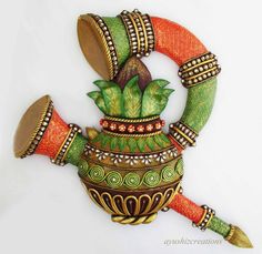 this is an image of a decorative item made out of wood and painted with colors