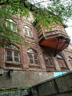 an old building with many windows and balconies