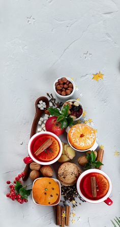 a christmas tree made out of bowls filled with different types of food and spices on top of each other