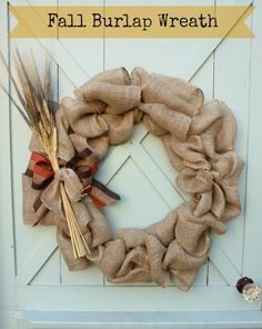 a fall burlap wreath hanging on the front door