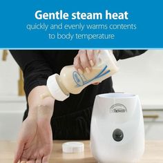 a person is pouring water into a blender on a table with the words gentle steam heat quickly and evenly warms contents to body temperature