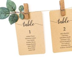 two tags with leaves are attached to clothes pins that read table 1, 2, and 3