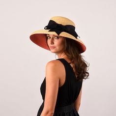 The Wauwinet hat is the epitome of New England elegance. An eye catching pink underbrim makes this style one of a kind. Featuring a tall crown and a downturned brim, this dramatic hat is sure to turn heads. Material Our thin leghorn straw is hand-braided and then lock-stitched and blocked into shape. This is our stiffest straw. Trim Ships with our widest 3" black grosgrain ribbon with a hand-tied bow. We recommend a 3" ribbon due to the height of the crown on this shape. However, this hat can al Tall Crown, Wide Brim Straw Hat, Hat Box, Ribbon Trim, Wide Brimmed, Straw Hat, Grosgrain Ribbon, Resort Wear, New England