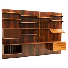 a wooden shelf with several shelves and drawers