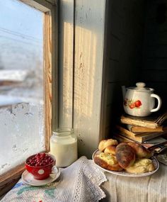 a plate of food sitting on top of a table next to a window