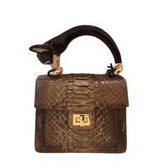 a brown snake skin handbag on a white background