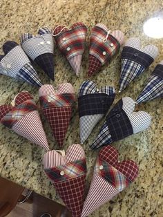 several hearts are placed on the counter top with one being folded up to look like they have been made out of fabric