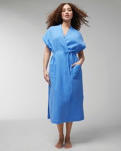 Whether you are wearing it as a house dress or throwing it on after a steamy shower, our Cotton Gauze Robe will keep you covered without overheating you. The fabric is quick drying and the shorter sleeves make this a warm weather favorite. Details Detachable belt Short sleeves Front pockets 50" on body Quick-dry fabric 100% Cotton Machine wash cold with similar colors. Line dry. Warm iron if needed. | Women's Cotton Gauze Robe in Dreams Come Blue size Medium | Soma Sleep Clothes, Soma Intimates, Belted Shorts, House Dress, Women Lingerie, Warm Weather, Short Sleeves, Fabric, Women Shopping