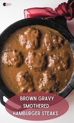 brown gravy smothered hamburger steaks in a cast iron skillet