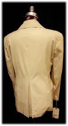 "This Double Breasted Sportscoat is an amazing example of an era that defined fashion for many of the collectors of today. The big lapels and fancy collar makes this artful jacket even more fun, but is the single slanted breasted pocket that makes this a truly unique find. The piece was Tailored by Duke's ~ Man's Shop ~ 309 Travis St. ~ Houston. Suit is dated inside the inner pocket \"1969\". Very European. Coat measures ~ Shoulders 20 inches, Chest 42 inches, Sleeves 25 inches and length form n Fitted Cream Outerwear With Pressed Crease, Fitted Single Breasted Cream Sport Coat, Fitted Beige Sport Coat For Tailoring, Fitted Cream Single Breasted Sport Coat, Fitted Cream Single-breasted Sport Coat, Classic Long Sleeve Cream Sport Coat, Fitted Cream Sport Coat For Semi-formal Occasions, Fitted Beige Outerwear With Pressed Crease, Fitted Beige Retro Blazer