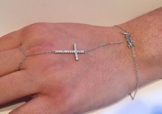 925 STERLING SILVER LADIES DESIGNER CROSS WITH THE WORD FAITH BRACELET RING  WITH  .75 CARATS OF MAN MADE DIAMONDS.........TOTAL WEIGHT 2.1 GRAMS........... AMAZING DESIGN THAT WILL OVERWHELM  ANYONE......LOOKS 100 TIMES BETTER IN PERSON THAN IN THE PICTURES!!!!!!. TOP QUALITY DESIGN WITH SUBURB WORKMANSHIP AND FINISH..... RETAILS OVER $ 188.00...... THE PRICE YOU ARE GETTING THE SET CANT EVEN BUY THE RING ITSELF ..STB00503... AMAZING LOOK AT INCREDIBLE SAVINGS!!!!!! Adjustable White Gold Cross Jewelry, Cross Word, Faith Bracelet, Bracelet Ring, Man Made Diamonds, Ring Bracelet, Cross Necklace, Arrow Necklace, Diamonds