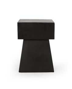 a small black table sitting on top of a white floor