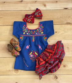 Beautiful! Mexican outfits ! SHOES NOT INCLUDED- sold separately. EACH OUTFIT HAS UNIQUE EMBROIDERY. Outfit includes: hand embroidered blouse , blood and headband. Outfit must be hand wash and hang to dry. Material: poplin fabric and cambaya fabric. True to size. Cute Embroidered Fitted Sets, Cute Embroidered Spring Sets, Summer Embroidered Multicolor Sets, Embroidered Blue Summer Sets, Summer Embroidered Blue Sets, Summer Blue Embroidered Sets, Embroidered Red Summer Sets, Mexican Outfits, Hand Embroidered Blouse