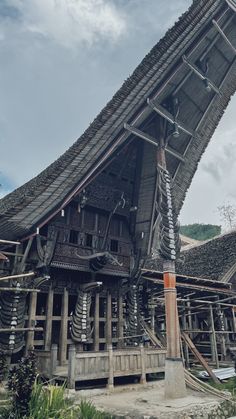 an old wooden building with many pipes running through it