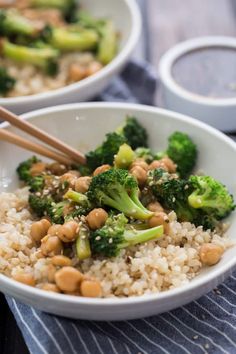 two bowls filled with rice, broccoli and chickpeas