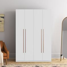 This freestanding 2-section wardrobe fits the bill when short on closets or storage space. It is made from engineered wood in your choice of neutral finish. The two doors each have streamlined aluminum pulls and are open to reveal many versatile and customizable storage. Two interior soft-close drawers are ideal for small items and accessories, while there is plenty of floor space for shoes and boots. Position the hanging rods to suit your needs - for shirts and blazers or longer items like slac Freestanding Wardrobe, Wardrobe Laminate Design, Armoire Closet, Closet Wood, Wood Armoire, Wardrobe Organisation, Bedroom Armoire, Bedroom Space, Wardrobe Armoire