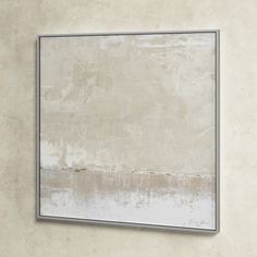 a painting hanging on the wall in front of a white and grey background with no people