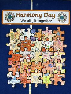 there is a puzzle piece with words on it that says harmony day we all fit together