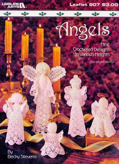 an old fashioned crocheted angel set with candles