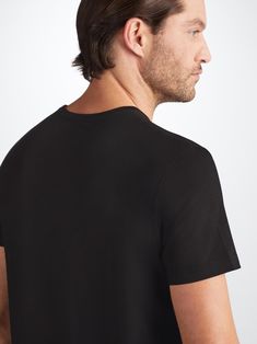 Our signature Basel men’s t-shirt in black is a wardrobe essential: versatile and classic. Made from a unique blend of stretch micro modal for an extraordinarily soft and comfortable wear, it will quickly become your go-to black t-shirt. Perfect for sleeping, lounging or making a long-haul flight a lot more bearable. Featuring a soft crew-neck band finish and a streamlined shape that is both comfortable and flattering, we've elevated this loungewear t-shirt into a luxury essential. One of our si Classic Black Loungewear Tops, Long Haul Flight, Long Haul, Body Heat, Basel, Black Pattern, Soft Black, Black T Shirt, Free Shopping