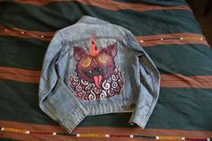 Denim Jacket With a picture of a fun bat sewn to the back. With a pack of howling bone wolves this jacket is great for a breezy night out in the spring or in the summer, but can definitely be worn in the colder months with a warm sweater underneath for a cozy look! -If there is a size or style that is not listed here please send a message and I will try to help you find what you're looking for. - REFUND - I accept returns if they do not fit. You can get a Refund of the item (excluding shipping costs) if you mail it back. Spring Cotton Outerwear For Alternative Fashion, Fall Festival Outerwear With Graphic Print, Graphic Print Outerwear For Fall Festival, Alternative Cotton Outerwear For Spring, Cotton Outerwear With Graphic Print For Alternative Fashion, Casual Cotton Denim Jacket For Alternative Fashion, Warm Sweater, Warm Sweaters, Wolves