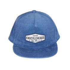 Image of Blue Corduroy Kids Trucker Hat with Knuckleheads Patch: A vintage-inspired and stylish accessory designed for kids. In a rich blue corduroy fabric Blue Trucker Hat, Mechanics Jacket, Blue Corduroy, Hat Design, Kids Hats, Hat Designs, Swim Shorts, Trucker Hat, For Kids