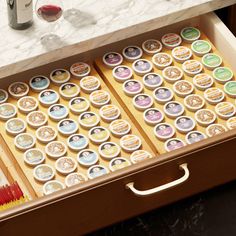 the drawer is filled with different types of buttons