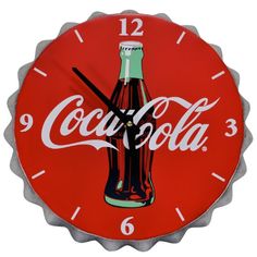 a coca - cola clock is shown on the wall