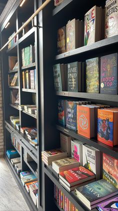 the bookshelves are filled with many different types of books