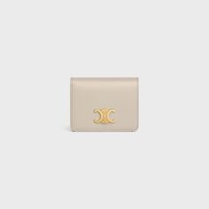 TRIOMPHE COMPACT WALLET IN SHINY CALFSKIN - LIGHT STONE | CELINE Celine Triomphe Wallet, Celine Triomphe, Fragrance Bottle, Compact Wallet, New Fragrances, Small Leather Goods, Calf Skin, Bag Accessories, Online Store