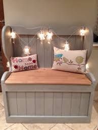 a bed with lights on the headboard and foot board, made out of wood