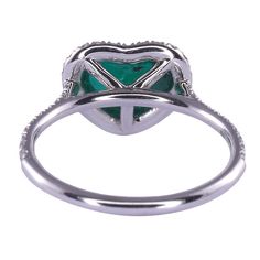 This is part of Chairish’s Fine Jewelry assortment.  Estate heart cabochon Colombian emerald ring. This heart ring is crafted in 18 karat white gold featuring a 2.45 carat heart shaped cabochon Colombian emerald. The heart emerald ring has .35 carat total weight of diamond accents and is excellently made. This unique Colombian emerald ring is a size 6.25.  Exact dimensions for this item are unknown.  Please reference the measurements noted in the description above for the best approximate dimensions. Please reach out to the seller under "Ask the Seller" for specific questions regarding the measurements. Heart-cut Emerald Ring For Formal Occasions, Heart Cut Emerald Ring For Formal Occasions, Formal Heart Cut Emerald Ring, Luxury Heart-shaped Ring With Halo Setting, White Gold Heart Cut Emerald Ring, Formal Heart Cut Emerald Ring With Prong Setting, Formal Heart Cut Emerald Ring With Gemstone, Formal White Gold Heart Ring With Gemstone, Heart-shaped Emerald Promise Ring