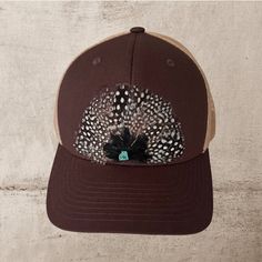 Made to order Beautiful feather hat trucker hat  Black with peacock blue feathers  Stone with brown and orange feathers ad a turquoise bead.  Black with Hot Pink and Black feather and a black center bead.  Snap back adjustable.  You will get Tons of Compliments! Brown Country Hat With Feathers, Brown Hats With Feathers For Country Events, Brown Feathered Hat For Country Events, Country Style Brown Hat With Feathers, Brown Feathered Country Hat, Bohemian Brown Hat With Feathers, Brown Festival Trucker Hat, Brown Hats With Feather Trim And Curved Brim, Brown Curved Brim Hat With Feather Trim