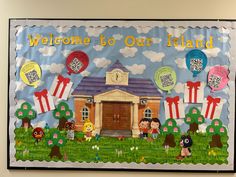 a welcome to our island bulletin board with balloons and kids in the grass outside it