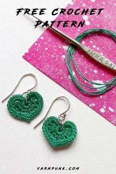 two crocheted heart earrings with the words free crochet pattern on them