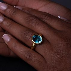 One-of-a-kind, hand-crafted ring centering 10.20 carat oval shape, fine gem quality vivid color Blue Zircon set in 18karat yellow gold bezel and 22karat yellow gold hammered setting. Size 7, can be sized upon request. Zircon might be one of the most under-appreciated colored gemstones and please do not confuse it with cubic zirconia, or CZ, an artificial product from the mid-1970s. Zircon found in Australia is the oldest mineral on earth: 4.4 billion years old. In the Middle Ages, this gem was t Gold Oval Cabochon Topaz Ring, Gold Oval Cabochon Topaz Ring Gift, Gold Topaz Oval Cabochon Ring As Gift, Gold Oval Topaz Ring With Bezel Setting, Oval Yellow Gold Topaz Ring With Bezel Setting, Handmade Gold Topaz Ring With Oval Shape, Handmade Gold Topaz Ring In Oval Shape, 3d Printed Necklace, 3d Printed Earrings