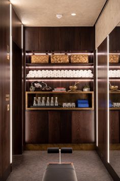 the inside of a store with wooden shelves filled with items