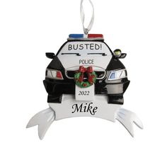 a police car ornament with a wreath on it's hood and the words busted