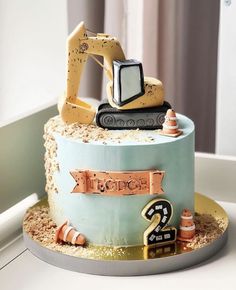 there is a birthday cake with a construction theme on it