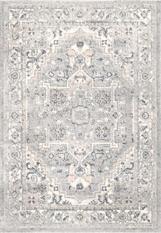 a gray and white rug with an ornate design