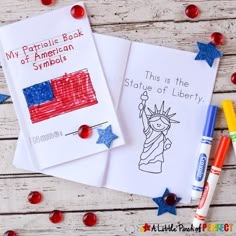 two patriotic books with crayons on the table