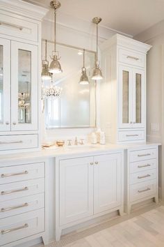 the bathroom vanity cabinets with lights are all white