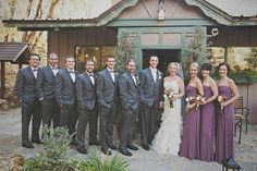 a group of people standing next to each other in front of a building