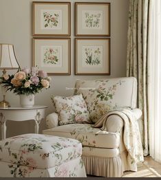 a living room filled with furniture and pictures on the wall