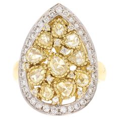 This ring has Natural Pear Cut Yellow Diamonds that weigh 1.75 carats and also Natural Round Cut White Diamonds that weigh 0.59 carats. The total carat weight of the ring is 2.34 carats. The clarity of the yellow diamonds is VS2 and the clarity and color of the white diamonds is VS2-F. Curated in 18 Karat Yellow Gold and has an approximate gold weight of 10.3 grams. The ring is a size 7 but can be re-sized free of charge. Trillion Diamonds, Yellow Gold Cocktail Ring, Yellow Diamonds, Morganite Diamond, Platinum Diamond Rings, Gold Cocktail Ring, Gold Cocktail, Pink Morganite, Cushion Diamond