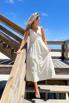 Step into the summer sun with style in the Salty Wishes Empire Waist Linen Midi Dress , a natural-colored beauty that exudes easy elegance. With a v-neckline and empire waist design, this lightweight midi dress is the epitome of effortless chic. Whether you're strolling along the beach or attending a garden party, this versatile dress is the perfect canvas for you to accessorize and make your outfit truly pop.   Features:   Natural color linen fabric for a breathable and comfortable wear.  Flatt Linen Beach Outfits, Linen Midi Dress, Versatile Dresses, Midi Maxi Dress, Effortless Chic, Summer Sun, Versatile Style, Boutique Dresses, Empire Waist