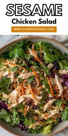 a salad with chicken, lettuce and carrots on it in a bowl